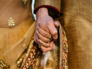 Image of Bride and Groom holding hands