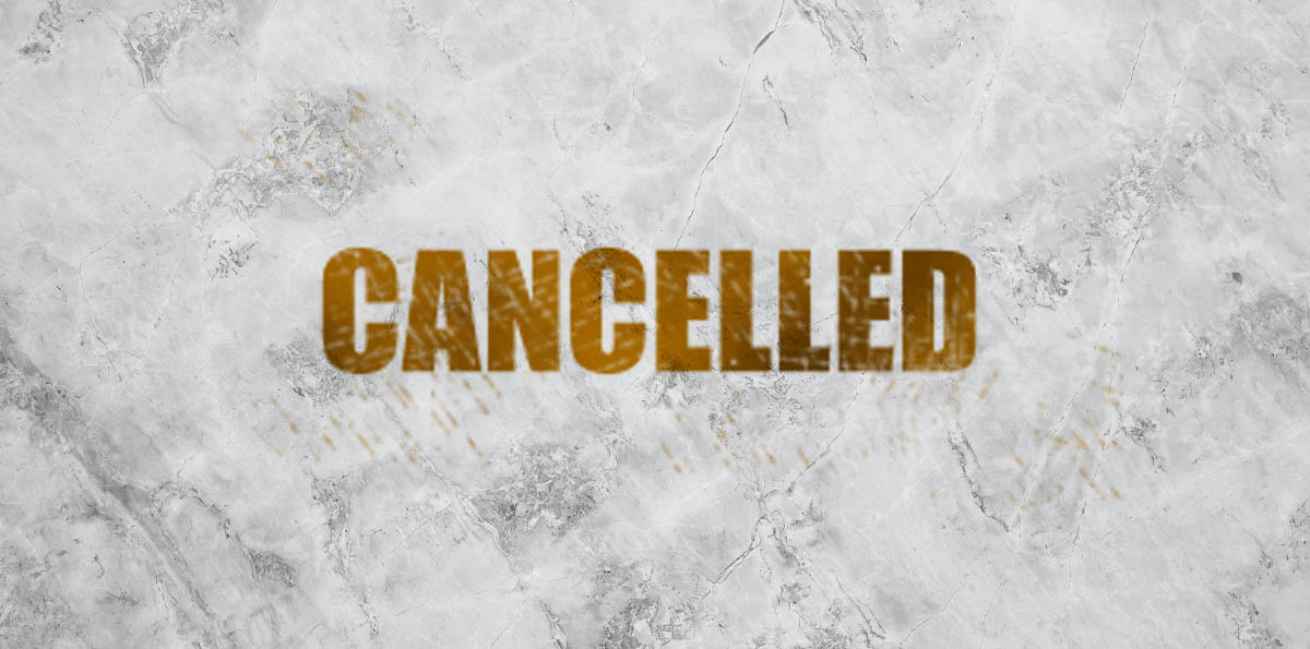 Image of the word 'cancelled' on a white marble background